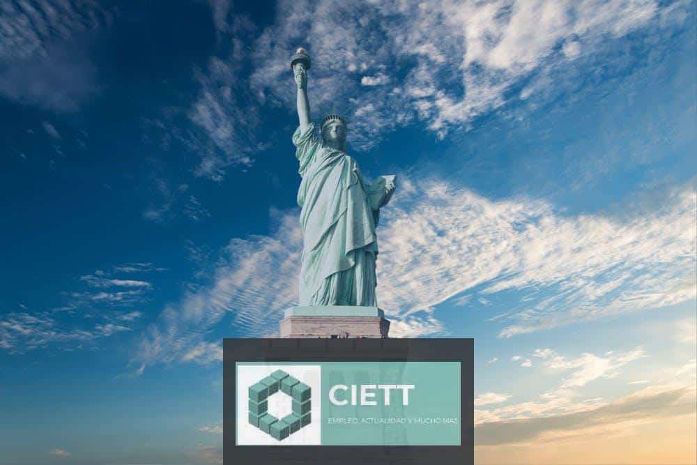 Iconic Statue of Liberty with a backdrop of a vibrant blue sky, symbolizing freedom and America.