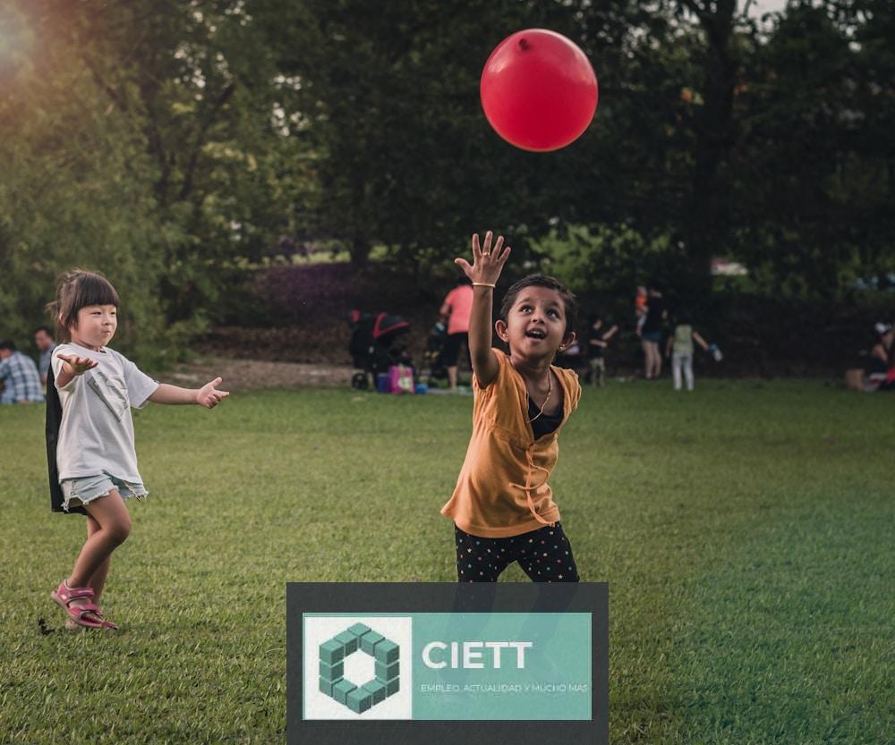 two girls playing balloon