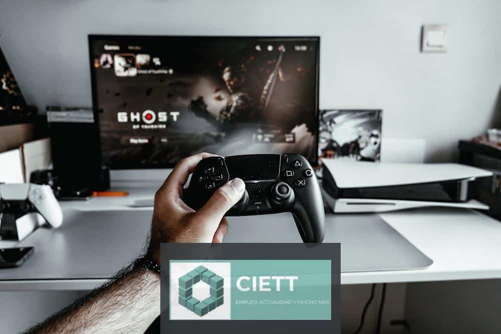a person holding a video game controller in front of a tv