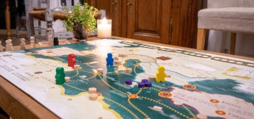 a table with a game board and game pieces on it