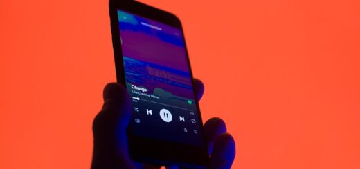 a person holding a smart phone in their hand