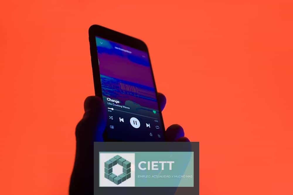 a person holding a smart phone in their hand