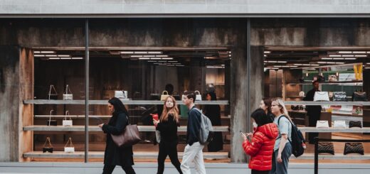 a group of people walking outside a store
